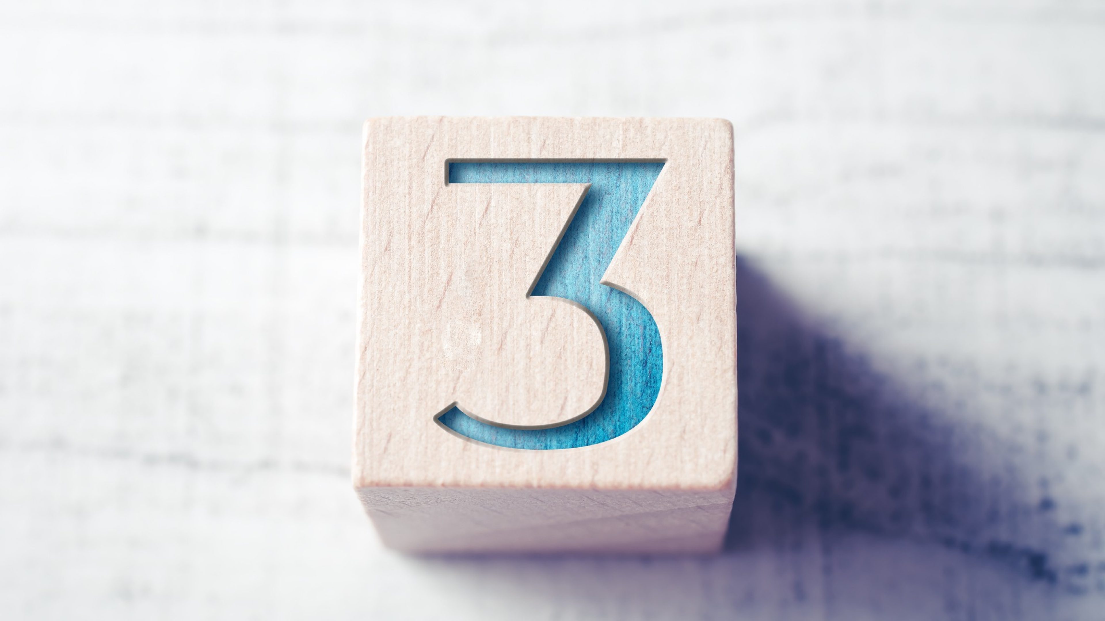 Number 3 On Wooden Block On A Table